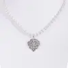 Perlencollier mit Ornamentanhänger ~ cremeweiß